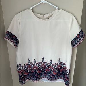 White short sleeve shirt with a fun print!